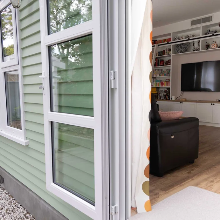 White NK aluminium window opening into renovated Beckenham Christchurch home