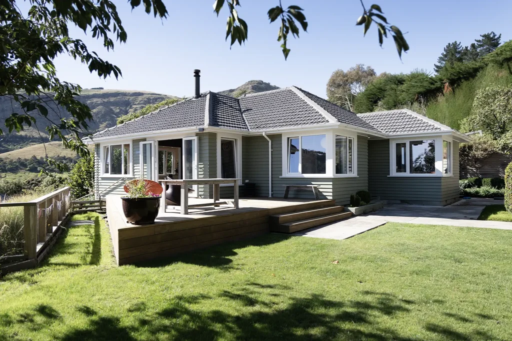 Heathcote Valley home exterior with deck and uPVC double glazed windows overlooking hills